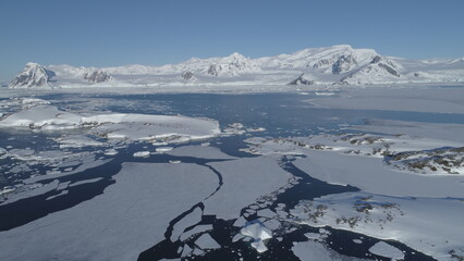 Arctic Polar Mountain Coast Aerial View. Snow Covered Antarctica Ocean Landscape Overview. North Nature Horizon Stunning Panorama Drone