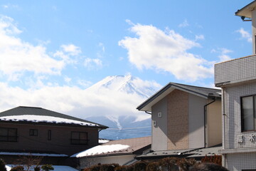 Mount Fuji behind japanese local house