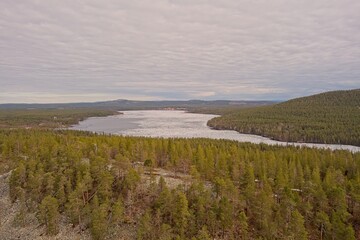 Aerial view of lake Pyhäjärvi in cloudy spring weather, Pelkosenniemi, Lapland, Finland.