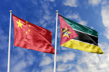 3d illustration. China and Mozambique Flag waving in sky. High detailed waving flag. 3D render....