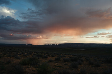 Sunset from Wahweap point in the town of Page, Arizona, with rain clouds in the background