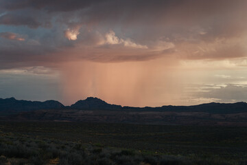 Sunset from Wahweap point in the town of Page, Arizona, with rain clouds in the background