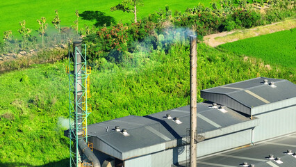 Industrial plant smoke, laden with harmful pollutants, poisons the air, posing grave health risks...