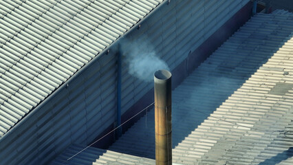 Smoke billowing from industrial estates, a dire aerial view via drones, demands immediate action for cleaner air. Public health impacts and Environmental degradation concept. 
 - obrazy, fototapety, plakaty