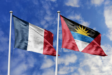 3d illustration. France and Antigua and Barbuda Flag waving in sky. High detailed waving flag. 3D...