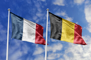 3d illustration. France and Belgium Flag waving in sky. High detailed waving flag. 3D render....