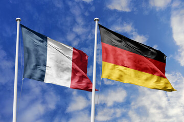 3d illustration. France and Germany Flag waving in sky. High detailed waving flag. 3D render. Waving in sky. Flags fluttered in the cloudy sky.