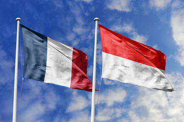 3d illustration. France and Indonesia Flag waving in sky. High detailed waving flag. 3D render. Waving in sky. Flags fluttered in the cloudy sky.