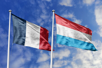 3d illustration. France and Luxembourg Flag waving in sky. High detailed waving flag. 3D render. Waving in sky. Flags fluttered in the cloudy sky.