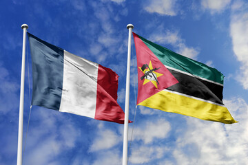 3d illustration. France and Mozambique Flag waving in sky. High detailed waving flag. 3D render. Waving in sky. Flags fluttered in the cloudy sky.