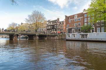 Fototapeta na wymiar Bridge in one of the canals of Amsterdam, the Netherlands