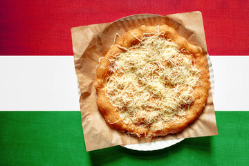 Langos with Hungary flag on wooden background