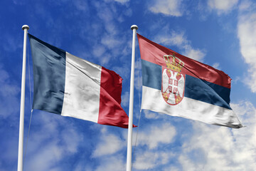 3d illustration. France and Serbia Flag waving in sky. High detailed waving flag. 3D render. Waving in sky. Flags fluttered in the cloudy sky.