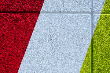 wall of red white and yellow colors on a building exterior