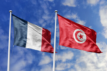 3d illustration. France and Tunisia Flag waving in sky. High detailed waving flag. 3D render. Waving in sky. Flags fluttered in the cloudy sky.