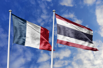 3d illustration. France and Thailand Flag waving in sky. High detailed waving flag. 3D render. Waving in sky. Flags fluttered in the cloudy sky.