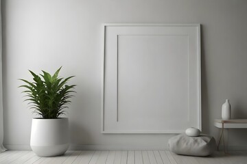 Mock-up of white picture frame on white wall, with minimalistic furniture and a green plant.