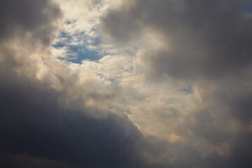 Sunlight breaks through the clouds, light on the clouds