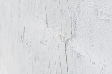 Close-up of plastering and smoothing a wall.