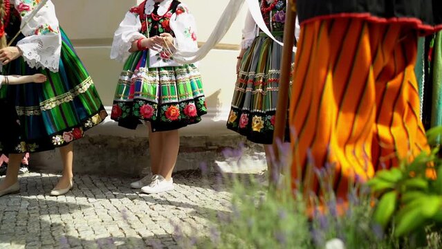 Łowicz Corpus Christi celebration. People in traditional Masovian costumes. Slow motion video. Polish folklore