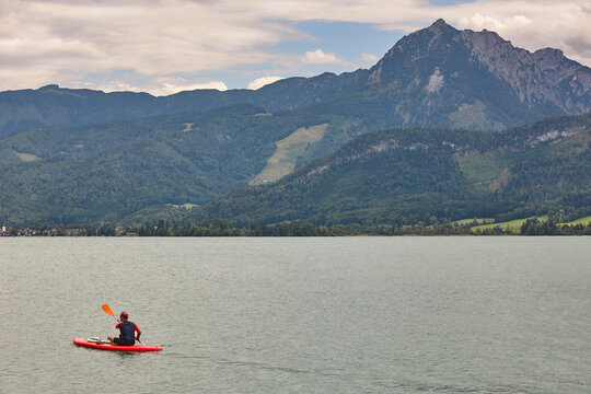 Padling on Wolfgangsee lake. Salzburg region. Austrian mountain landscape