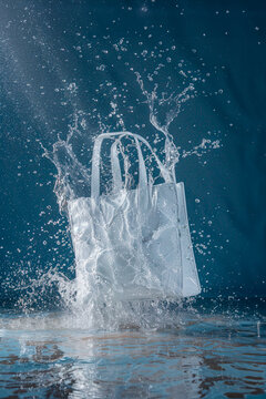 A white bag splashing while carrying on a water surface