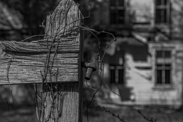Gate hinge of an abandoned house in the Delaware Water Gap National Recreation Area in black and...