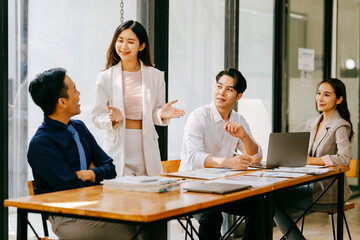 Team of young Asian entrepreneurs and startup have business meeting and encouraging each other for good spirit energy to accomplish successful marketing plan concept