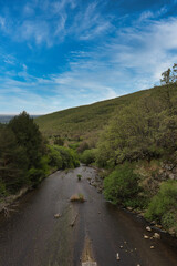 view of a mountain stream in spring in the sierra de guadarrama mountains