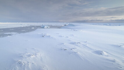 Infinitely, endless polar snowy desert in Antarctica. Frozen iceberg. South Pole frost surface....