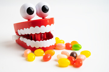 Sweet food and candy It cause tooth decay and root inflammation.