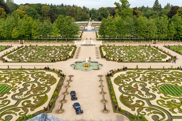 View of the palace gardens including two antique cars, from the roof terrace of Paleis het Loo in Apeldoorn, Netherlands