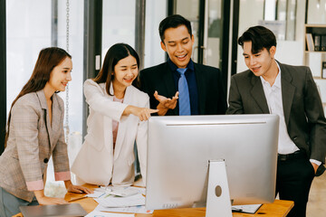 Meeting of Asian business people who are committed to work. Creative business teams work together...