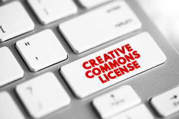 Creative Commons license - one of several public copyright licenses that enable the free distribution of an otherwise copyrighted work, text concept button on keyboard
