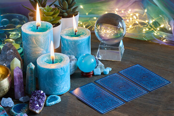 Mystical Tarot Reading Setup. Fortune telling. Mystical Still Life with Candles, Crystals and Tarot