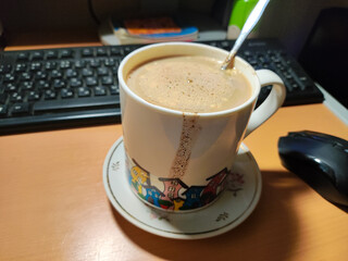 a large cup of homemade cappuccino. coffee with milk in a large cup. cup of coffee with drips.
