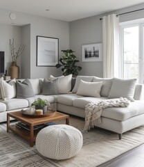 Fototapeta premium b'Bright living room with white sectional sofa and gray walls'
