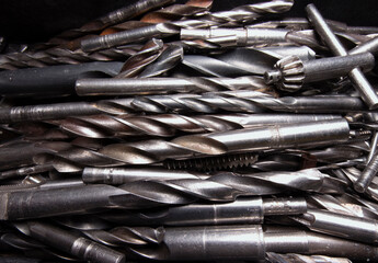 A pile of different drills on one pile