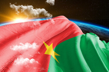 Burkina Faso national flag cloth fabric waving on beautiful night global cloud Background. - obrazy, fototapety, plakaty