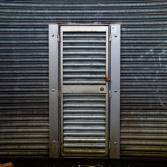 A steel shutter with a door
