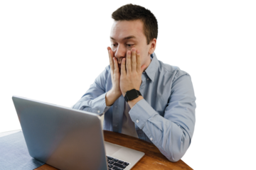 A male freelancer is stressed, tired of the deadline, uses a laptop, a cut-out background