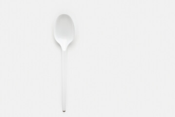 White plastic kitchen ladle spoon isolated