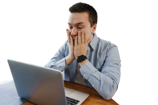 A male freelancer is stressed, tired of the deadline, uses a laptop, a cut-out background