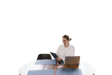 A woman working at home uses a laptop, cut out