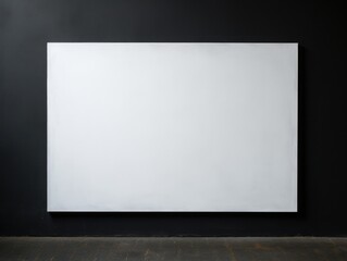 empty white painting on a black wall