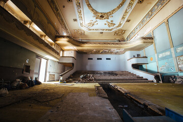 Large dark hall of old abandoned cinema theater