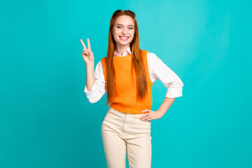 Photo portrait of pretty young girl show v-sign symbol wear trendy orange knitwear outfit isolated...