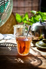Thai hot tea on wooden blackground, retro style , morning light