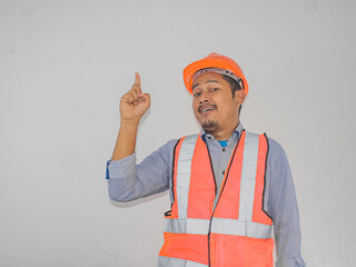 Asian workers wearing helmets are seen looking for ideas in completing work against white background