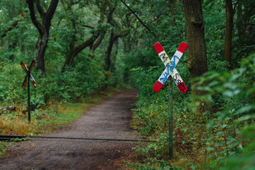 A railway crossing in the forest, St. Andrew's Cross in the forest